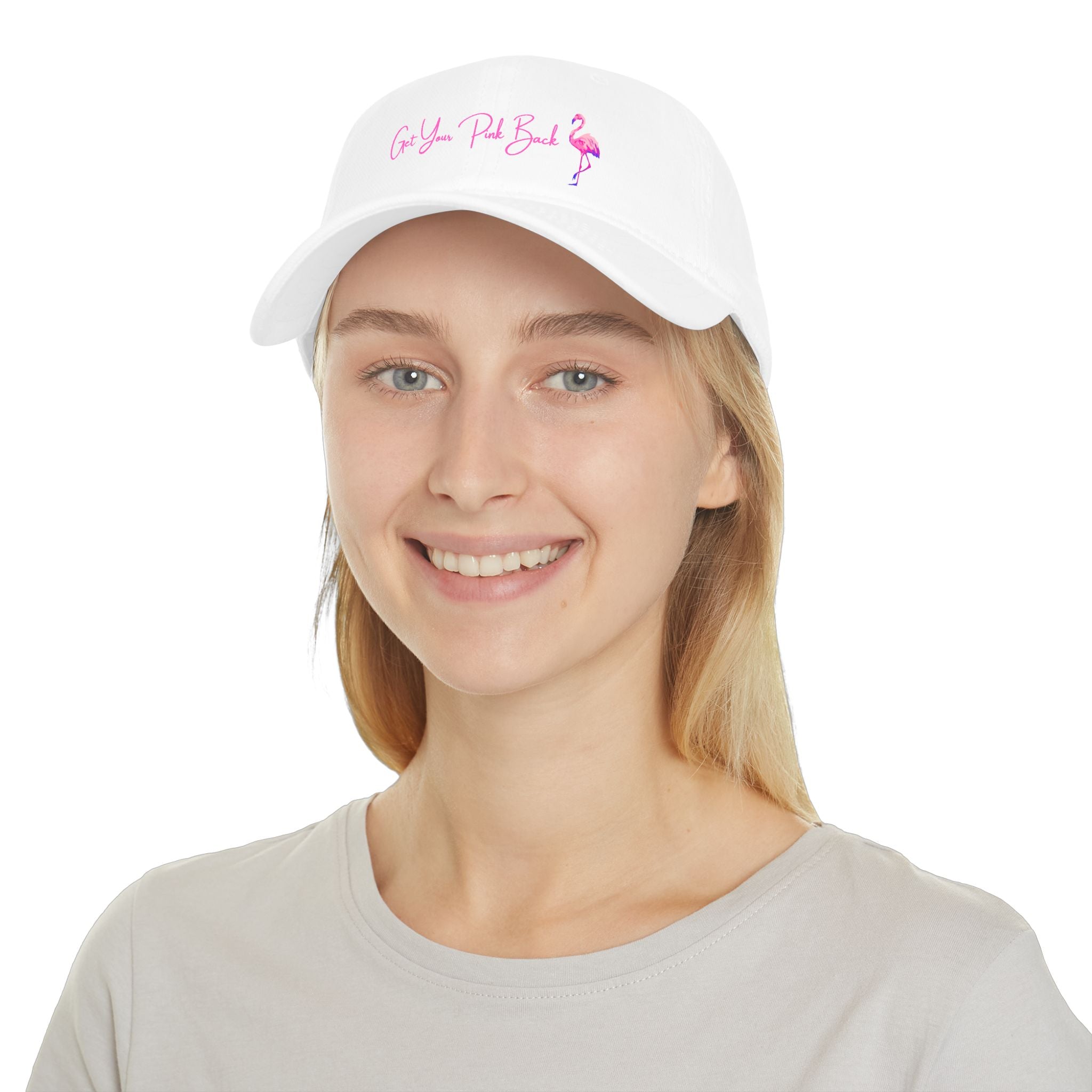 Woman wearing a white cap with pink text and flamingo design on a white background