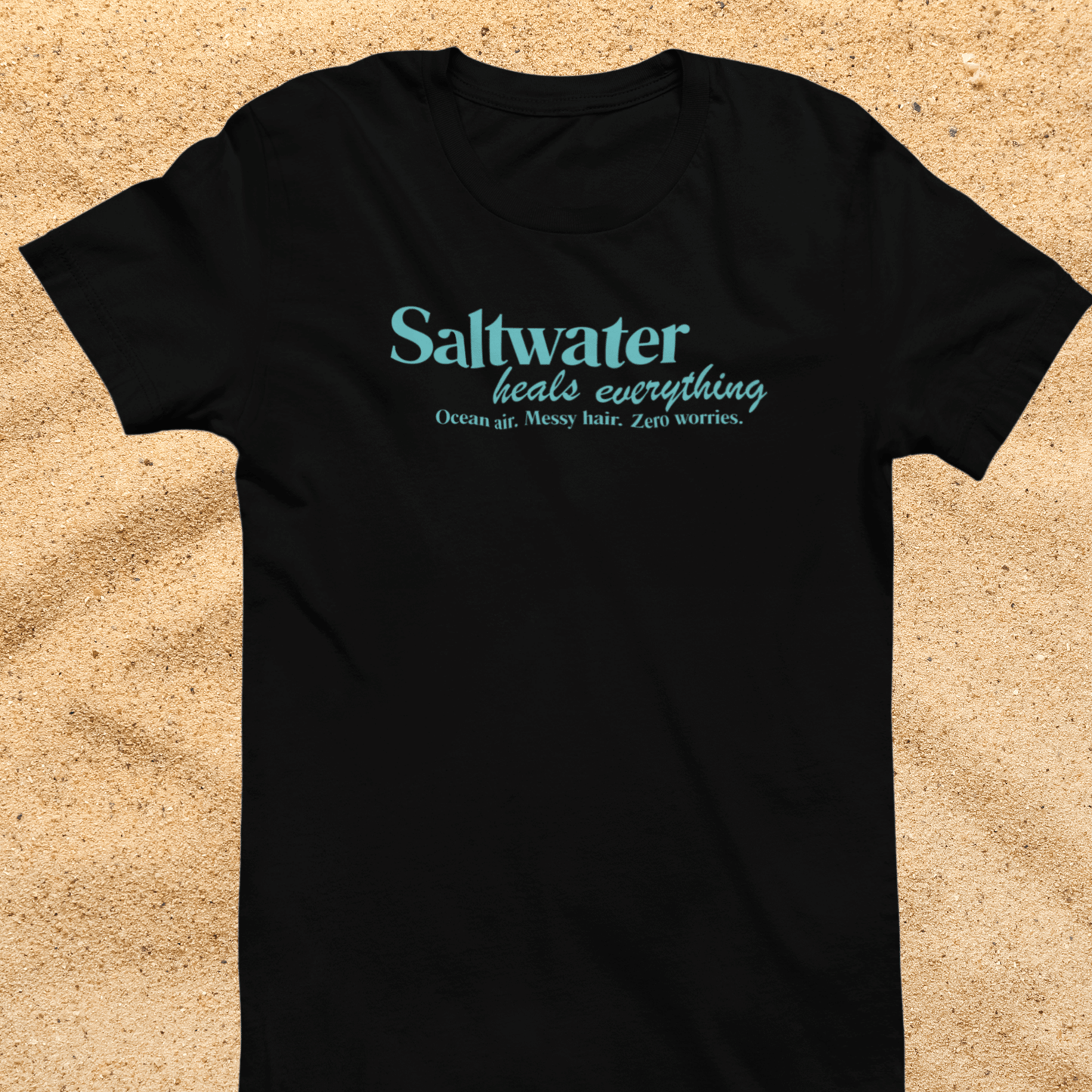 Saltwater Heals Everything Women's T-Shirt - Beach Coastal Graphic Shirt Blue Lettering